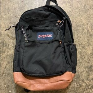 JanSport Black Backpack with Brown Accents